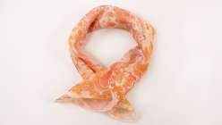 A pink marbled bandana made in Mercedez Rex's Marbling Finished Goods class on Creativebug. 