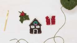 Crocheted holly, a crocheted gingerbread house, and crocheted gift made by Twinkie Chan in her Holiday Crochet Applique class on Creativebug