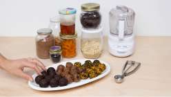 A plate of bliss balls plus all the ingredients needed for Cobrina's Creativebug class Bliss Balls: 3 Recipes for Snacking.