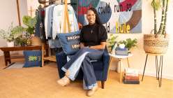 Sandra Lee Chandler wearing a pair of jeans she made in her Upcycled Denim: Side Seam Remix class on Creativebug.