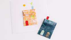 Two colorful paper houses made by Dawn M. Cardona in her Make a Wish Paper House class on Creativebug