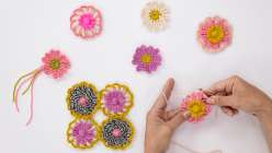 A selection of hand-loomed flowers made by crochet artist Twinkie Chan in her Flower Loom Basics class on Creativebug 