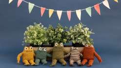 A family of crocheted frog toys made by Twinkie Chan in her Crochet a Posable Frog class on Creativebug