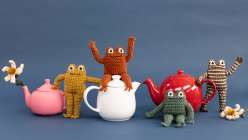 A family of crocheted frog toys made by Twinkie Chan in her Crochet a Posable Frog class on Creativebug